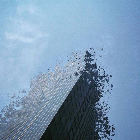 Deconstruction of a building over a blue sky background