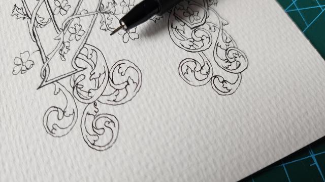 A work in progress piece, black ink line art leaves, swirling vines, and flowers surrounding thicker bars