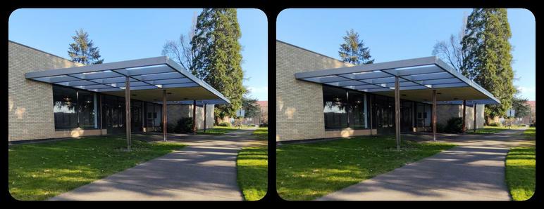 Path leading to entrance of modernist building.