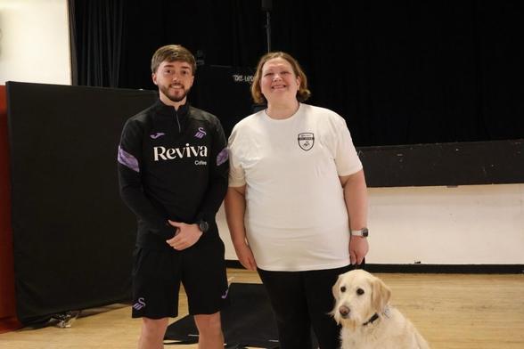 Izzy and guide dog Souly with trainer Jack Havard.