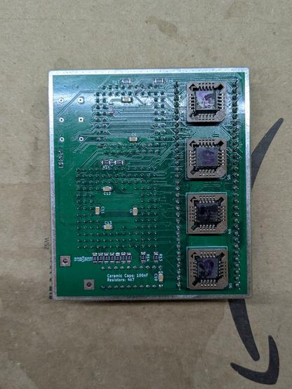 Photo of the underside of the MiniPerformer+. 4 PLDs are mounted on the underside, just in the middle of the 68000 footprint