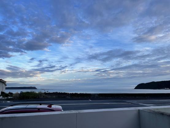 photo, morning view of calm sea and partly cloudy sky