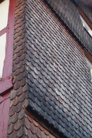 Weather side protected with wooden shingles of a half timbered house in Hessen, Germany