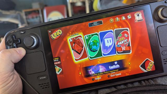 Held Steamdeck with the start screen of Uno on the screen.