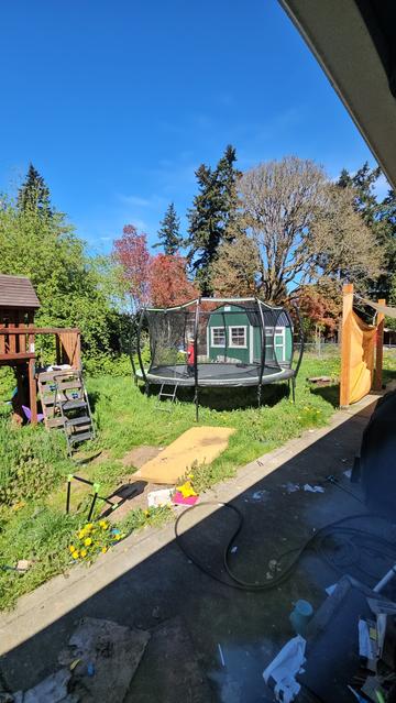 Photo showing my six year old wearing the VR headset while playing on the giant trampoline
