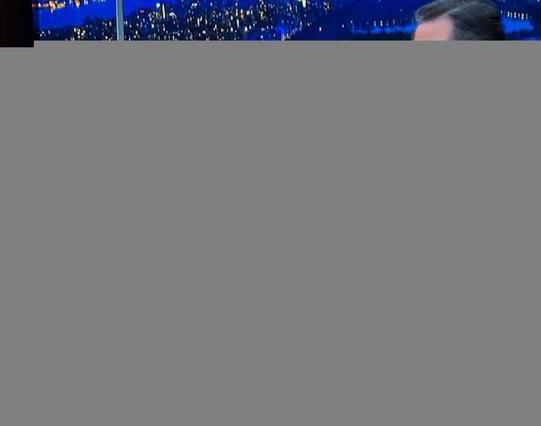 A photo of a television screen showing Senator Elizabeth Warren on the Late Show with Stephen Colbert