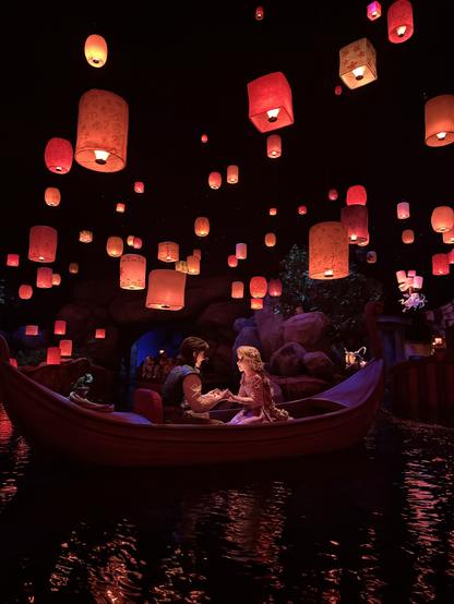Lantern scene from Tangled. Audio-Animatronic Flynn and Rapunzel are in a boat. Lanterns hang all around.