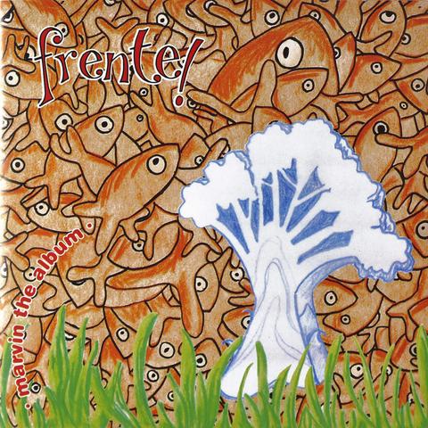 The cover of "Marvin the Album" which has a load of orange fish jammed like a wallpaper in the background, some grass and a white tree.

I'll let you image how it all fits together.