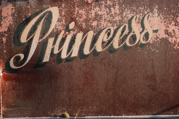 Coach-written word “Princess” on the side of an old coach