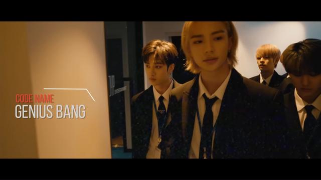 Bang Chan, Hyunjin, Seungmin and Dwaekki walking along a corridor. They're all dressed in dark suits. Supposedly they're all secret agents. There's a caption with a line to Bang Chan, and the text: Code name: Genius Bang