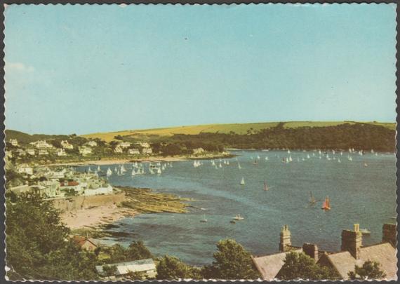 Printed colour postcard showing a view of St Mawes in Cornwall, seen from Castle Hill.

Published by Jarrold & Sons Ltd, Norwich, Cotman-Color, No CW.IC.

Postally used on 22 April 1960 with Mevagissey - St Austell cancellation on red 2½d stamp and sent to East Molesey, Surrey.

Good condition, with slight corner bumps, but some creasing to both bottom corners.