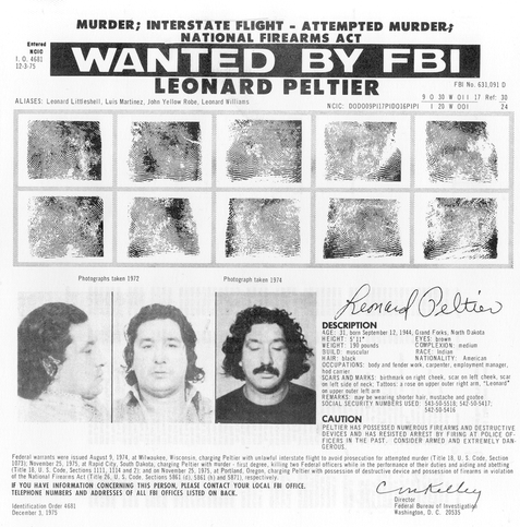 Free Leonard Peltier sign, March 2009, with stenciled image of Peltier. By kenny - KARPOV THE WRECKED TRAINUploaded by SaltyBoatr, CC BY 2.0, https://commons.wikimedia.org/w/index.php?curid=8540648
