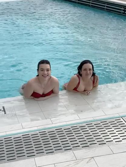 2 girls in a pool inside a ship