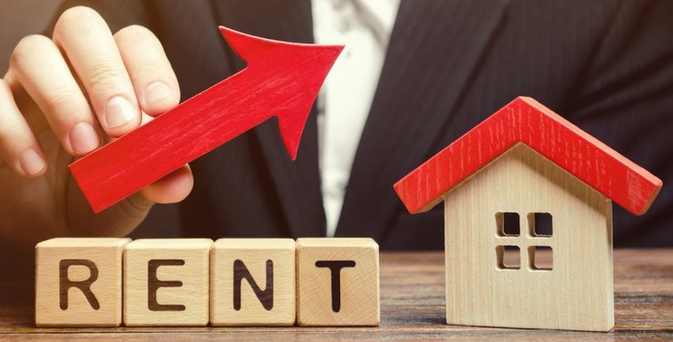 The Rent Is Too Damn Artificial
by Edward Erfurt, April 16, 2025

In January 2025, the U.S. Department of Justice sued six of the nation’s largest landlords, accusing them of using algorithmic pricing tools to artificially inflate apartment rents. The lawsuit argues that these companies—massive real estate holders managing over 1.3 million units—coordinated their rental pricing, using software developed by RealPage Inc. to exchange sensitive data & suppress competition in housing markets across 43 states.

This isn’t just about one piece of software. It’s about scale, structure, and a system that increasingly treats homes like stocks.

The lawsuit reveals a problem that goes deeper than bad behavior: The U.S. housing market is entangled with the financial system. We have been trained to see rising rents & home values as a sign of economic strength, but when those increases are the result of artificial manipulation rather than organic demand, that “growth” is an illusion. It’s profit without production — return without value.

The ripple effects of this entanglement are easy to see. High rents drive displacement. They prevent people from saving, starting families, or owning homes. They drain local economies. Yet, investors don't consider these effects when making decisions. They are investing in a financial product, not in shelter. Their focus is on whether their fund continues to grow.

Children's blocks spell out "rent" next to a wood toy house, with a wood red arrow above.