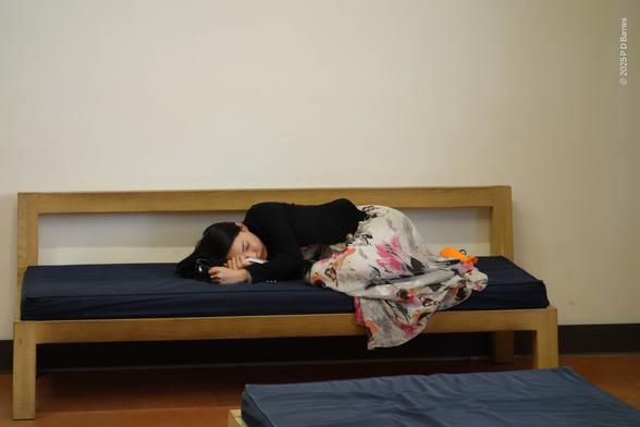 A young tourist lies asleep on a padded gallery bench in the Uffizi, sunglasses still clasped in one hand, overcome by beauty or perhaps jet-lag and leg-weariness.