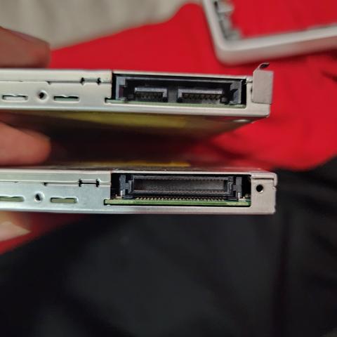 Two Apple SuperDrives with mismatched ports.