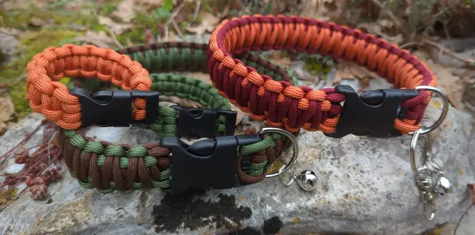 photo of two collars and two bracelets, they are made out of paracord and are orange and bordeaux, and green and brown respectively