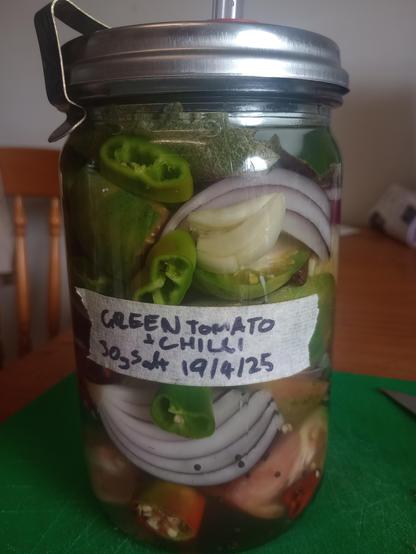 A jar of the same diced vegeables now with an airlock lid and a label
