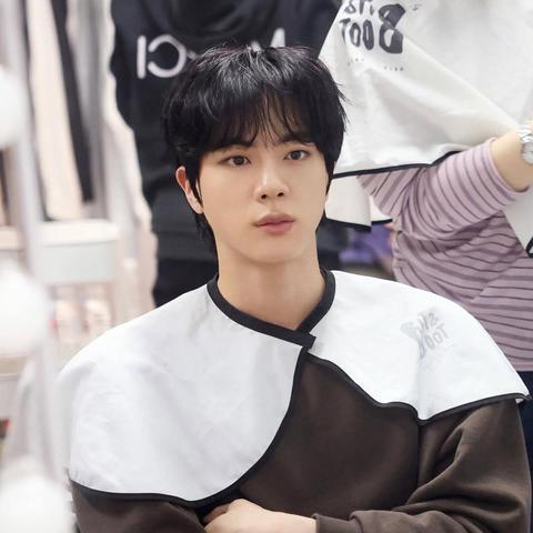 Jin prepping in the makeup room