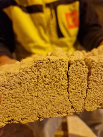 Cross section of tunnel cladding material afer a burn test.