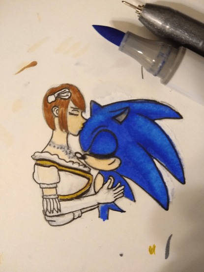 Tiny artwork of Princess Elise kissing a smiling Sonic on the forehead, his eyes shut and ear flicked back slightly. For scale, a Copic marker is at the edge of the image.