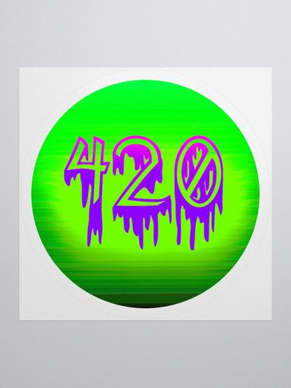 A circular shaped sticker. It's lime green and fades to darker shades of green on the bottom. It features the number 420 in creepy dripping font that fades from bright magenta to purple. There's a white border around the sticker. Light gray background.