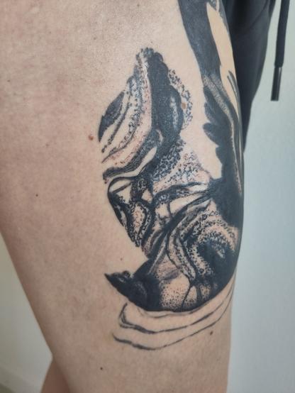Swan tattoo on a thigh