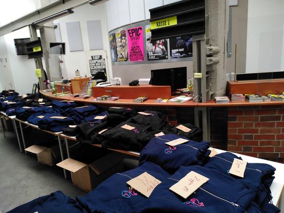 Tables full of EH22 branded shirts and zippers