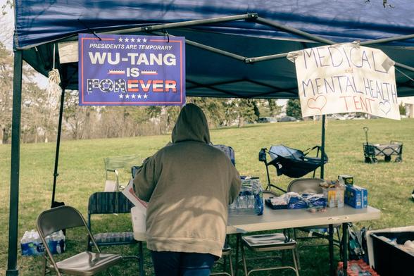 Medical Tent from the April 5 Hands Off Rally with a blue sign that reads 
"Presidents are Temporary
Wu-Tang is Forever"
