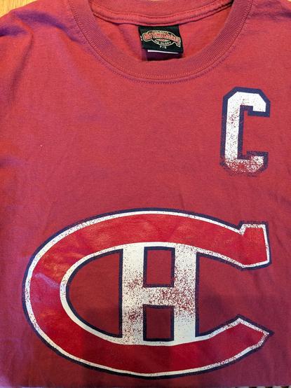 The front of an "Old Time Hockey" T-shirt with number 10 on the back.