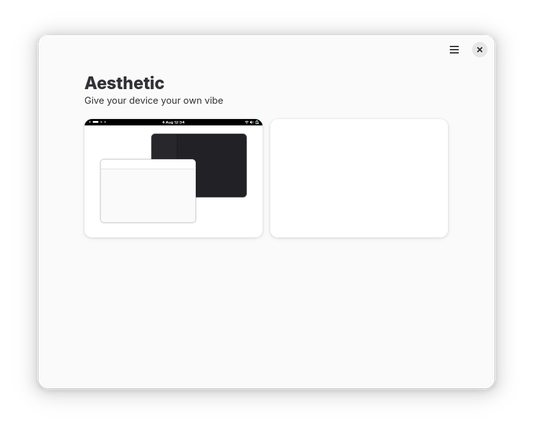 La imagen muestra una interfaz de usuario limpia y minimalista con el título “Aesthetic” y el subtítulo “Give your device your own vibe”.  En la parte central, hay dos tarjetas; una muestra una simulación del escritorio GNOME, mientras que la otra está vacía.  El diseño general es simple y moderno.