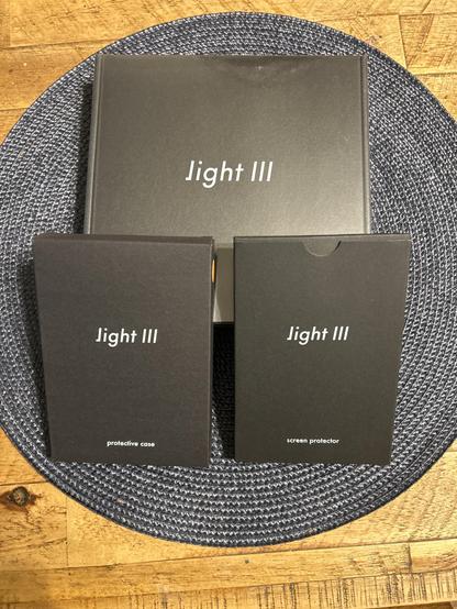 Boxes containing lightphone3, case, and screen protector.