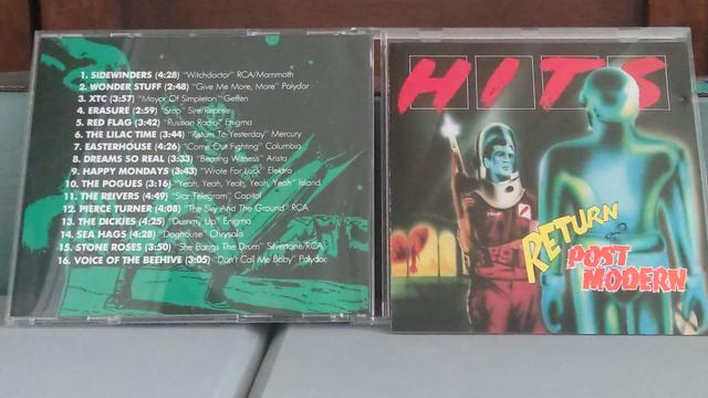 The front and back cover of the cd, Return Of Post Modern. The front cover (on the right) features what could be a scene from a 50s science fiction movie with one astronaut holding a ray gun. The back cover (on the left) shows a green and black background with the track list of songs in white lettering.