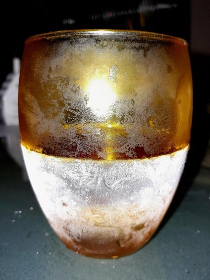 Subzero Mümmelman, a Jägermeißter analog, in a frozen glass tumbler with ice frozen into the bottom, and ice condensing on the outside, resembles an ice moon. Kinda.