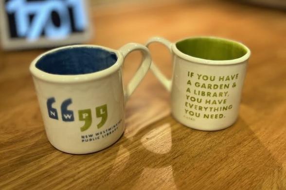 A coffee cup that says: New Westminster Public Library - If you have a garden and a library you have everything you need. Cicero.