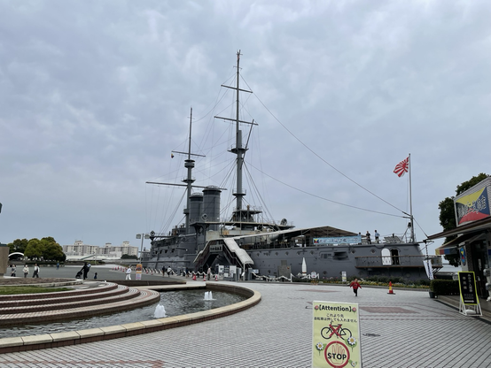 Photo of the pre-dreadnought Mikasa with a cloudy sky