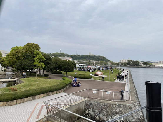 View from Mikasa’s bow showing a small crowd in the park.