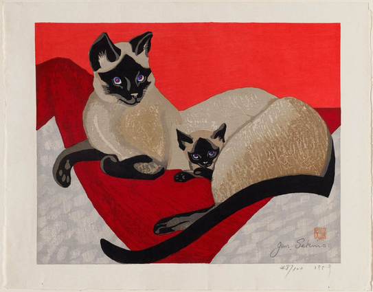 color woodblock print in landscape orientation depicting a mother Siamese cat sitting with her single kitten, who is tucked behind her back leg with its head peeking out; they appear to be lounging on a red and grey blanket, and the wall behind them is an even brighter red print is stamped/signed/dated/numbered in lower right corner