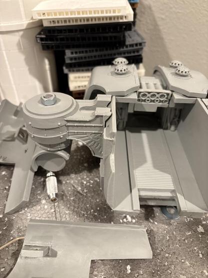 The body of the Titan, with various leg armor plates around it. The shoulder has been attached via a rod and bolt drilled through. (I later came back and sunk this further in on the top to give myself more room to work with on the shoulder pad)