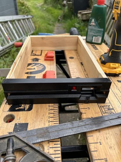 The real front of a Tandon TM858 from the CPT screwed to a wooden frame. I then screwed on the mounting bracket so it would fit properly in the machine.