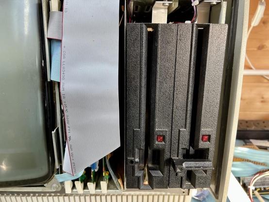 Fake floppy drive next to real floppy drive. Looks splendid.