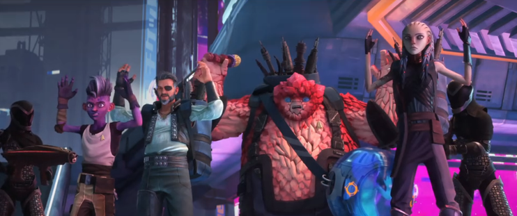 A shot of Dal, Okona, Rok and Gwyn all with both hands raised as Romulan Tal Shiar agents hold them at gunpoint.  Murf is sitting on the ground inside a transparent sphere.  They are on Noble Isle. 
From E115