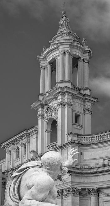 A figure from the Four Rivers fountain in the Piazza Navona in Rome Italy. The Church of Sant'Agnese is in the background. Processed in black and white. 

#statue #rome #italy #fountain #fourrivers #piazzanavona #church #belltower #baroque #blackandwhite #blackandwhitephotograpy #bernini #BuyIntoArt #AYearForArt #artforsale #wallartforsale #giftideas @joancarroll 

https://joan-carroll.pixels.com/featured/plata-river-god-and-church-rome-italy-joan-carroll.html