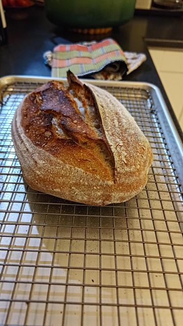 Two sourdough bread! Resting on a grate.