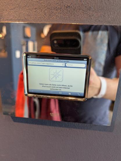 Chrome bath fixture with a display that shows safari on iPod Touch with an error message because it's not connected to the Internet.