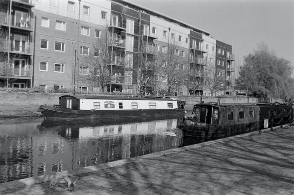 Canal boats, one Narrowboat and one Widebeam on the Leeds-Liverpool Canal in Wigan
