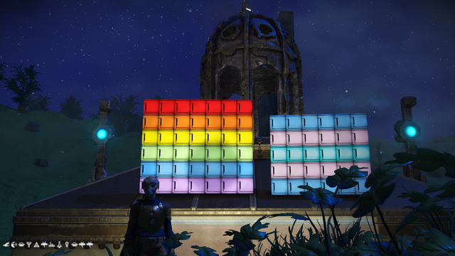 Two sets of light boxes, one with the traditional Pride colours (albeit with a lighter green), and the other with the trans flag colours (albeit with a blue-bounded 'white').