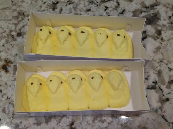 Picture of yellow marshmallow Peeps candy chicks. The eyes are missing or misplaced on them