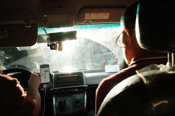 Bright light from the back seat of a taxi