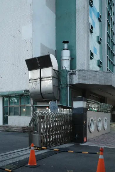 A geometric building with large ventilation vents